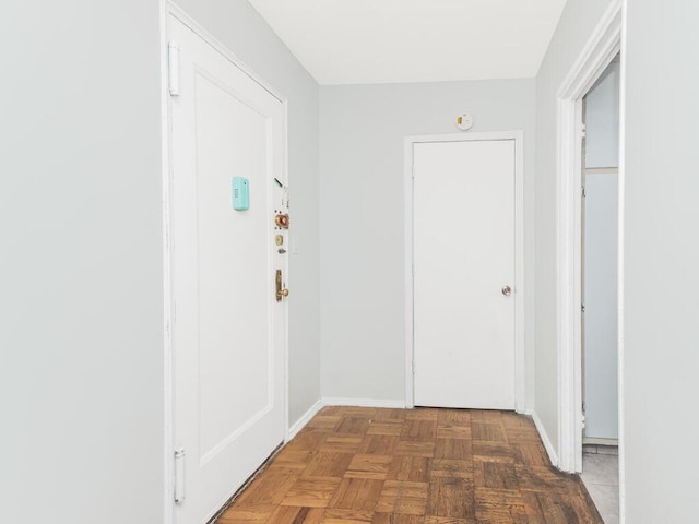 hall featuring dark parquet floors