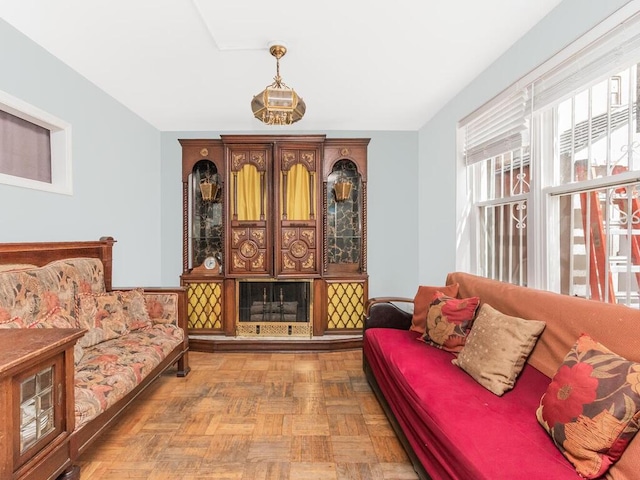 sitting room featuring parquet flooring