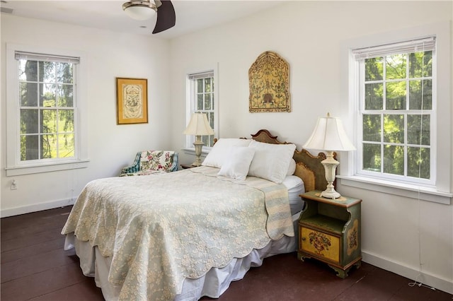 bedroom featuring dark hardwood / wood-style floors and ceiling fan