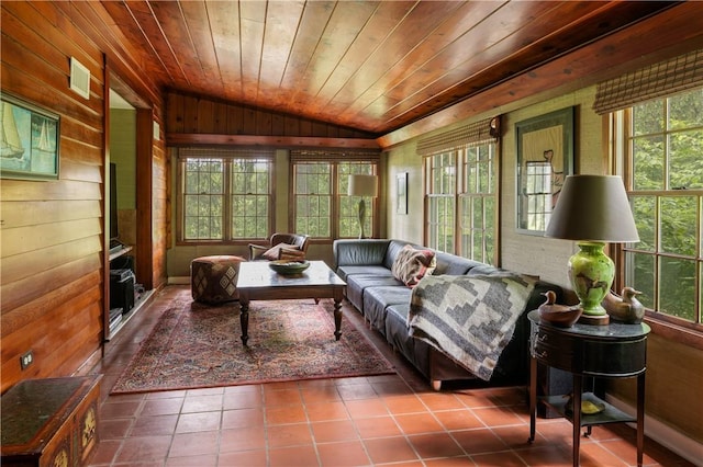 sunroom featuring lofted ceiling and wooden ceiling