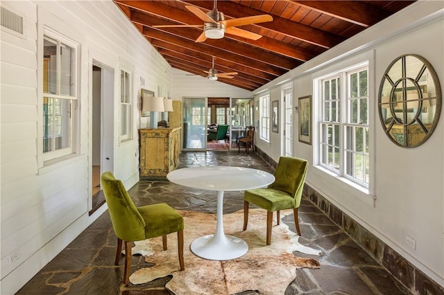 sunroom / solarium featuring vaulted ceiling with beams, ceiling fan, and wood ceiling