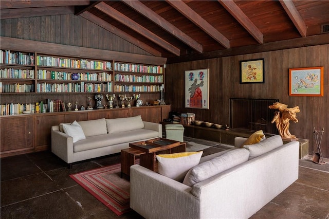 living room featuring lofted ceiling with beams, dark tile patterned flooring, wooden walls, and wood ceiling