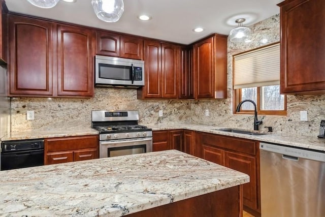 kitchen with a sink, light stone countertops, stainless steel appliances, backsplash, and recessed lighting