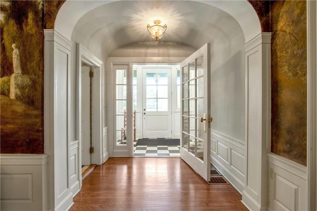 doorway to outside featuring hardwood / wood-style floors and french doors