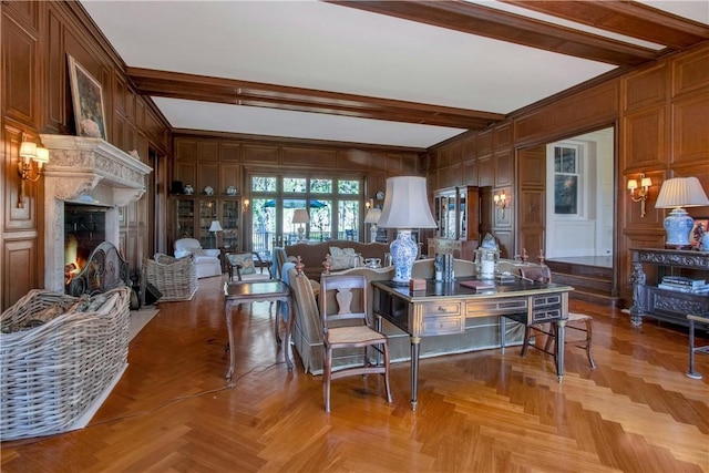 living room featuring wooden walls, light parquet floors, and beamed ceiling