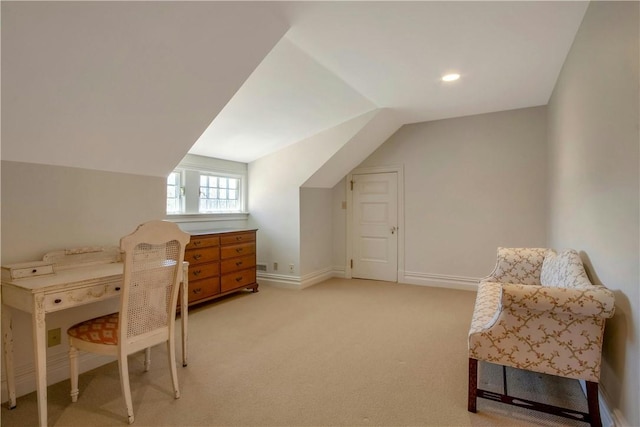 office area featuring light colored carpet and vaulted ceiling