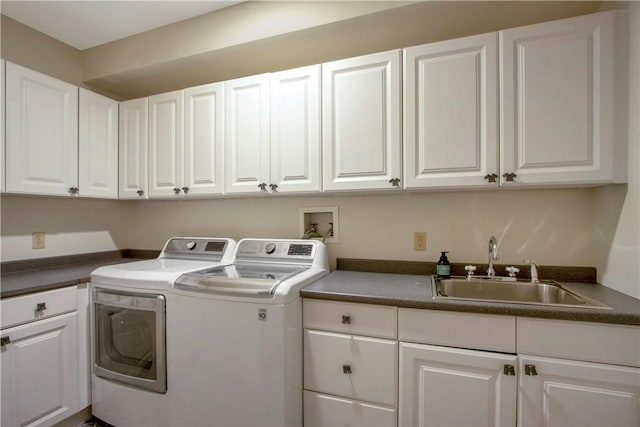 washroom with sink, cabinets, and independent washer and dryer