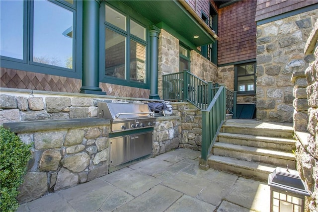 view of patio / terrace featuring area for grilling and exterior kitchen