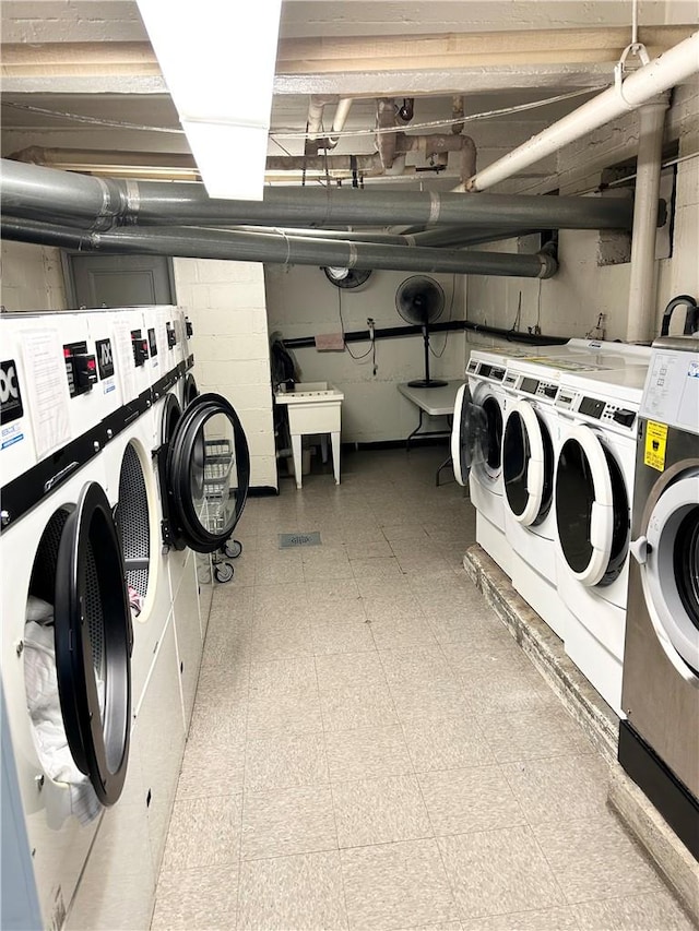 laundry room featuring independent washer and dryer and sink