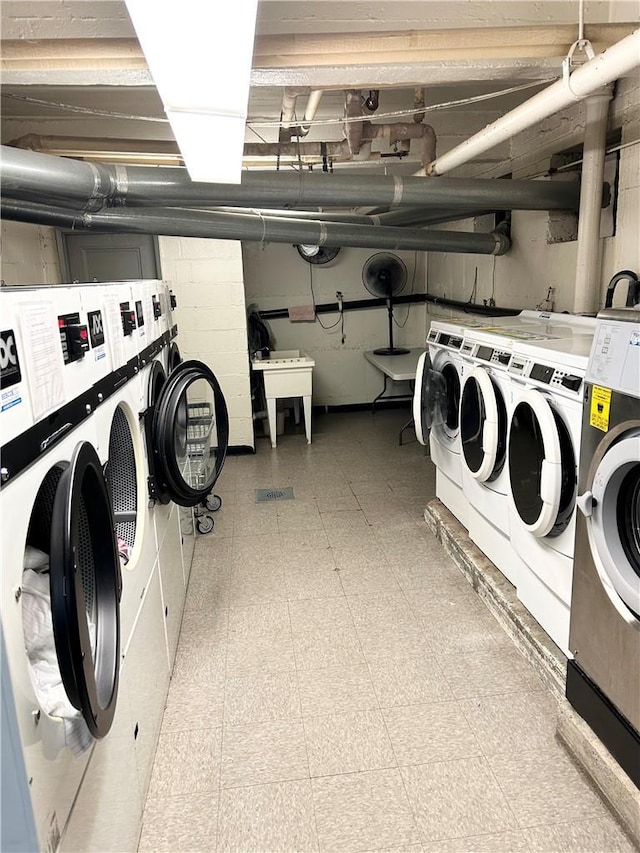 30 Fleetwood Ave Unit 4F, Mount Vernon, NY 10552 - community laundry room featuring washer and dryer and tile patterned floors