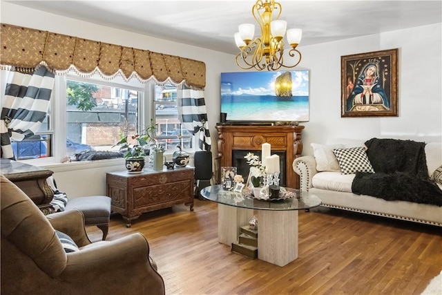 living area with a chandelier and hardwood / wood-style flooring