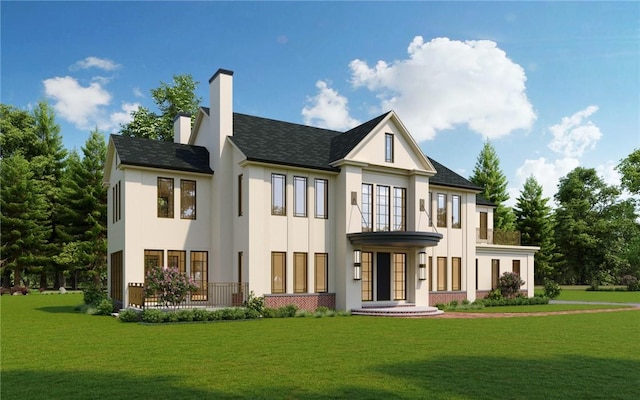 rear view of house featuring a yard and french doors