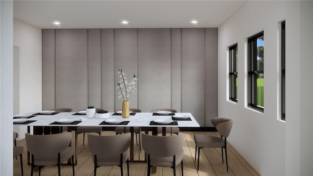 dining room with plenty of natural light and light hardwood / wood-style floors