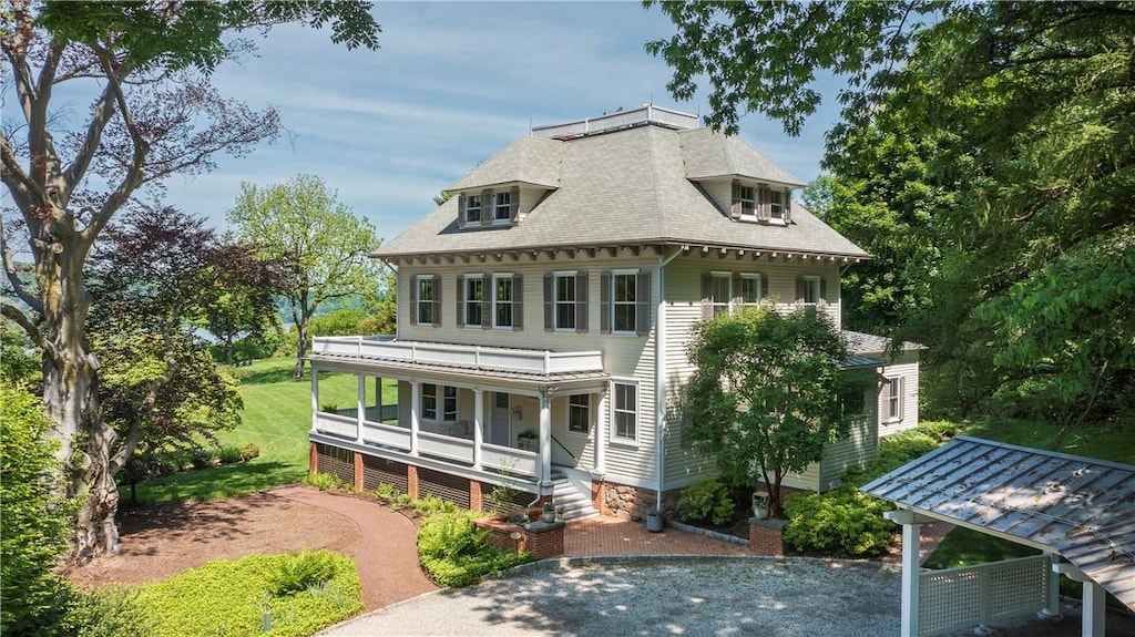 rear view of house with covered porch