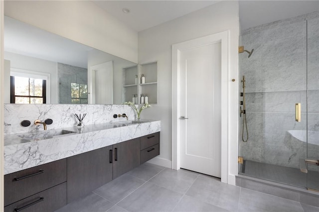 bathroom featuring tile patterned floors, a shower with door, and vanity