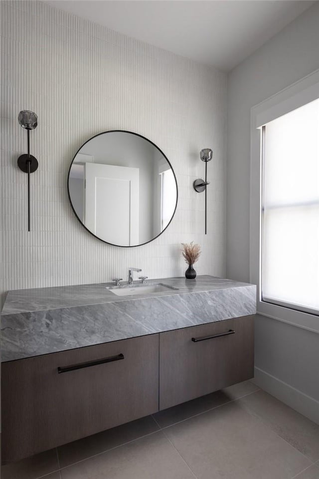 bathroom featuring tile patterned flooring and vanity