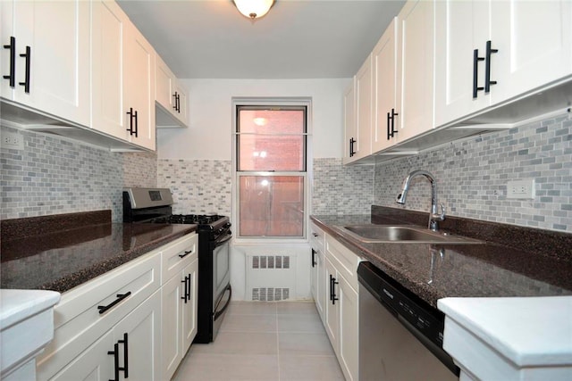 kitchen with backsplash, black range with gas stovetop, sink, dishwasher, and white cabinetry