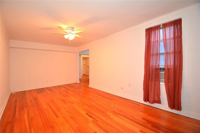 unfurnished room with hardwood / wood-style floors and ceiling fan