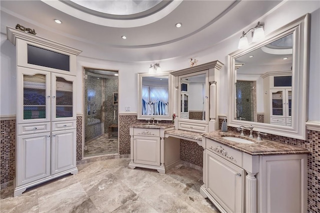 bathroom with french doors, vanity, tile walls, and a shower with shower door