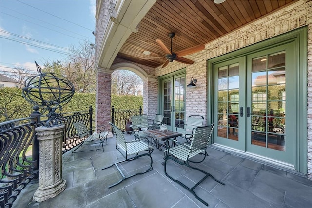 view of patio with ceiling fan and french doors