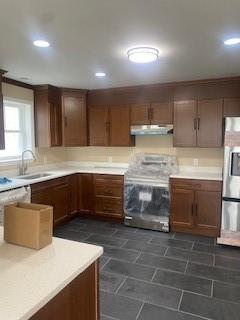 kitchen with sink and appliances with stainless steel finishes