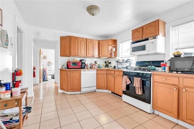 kitchen with decorative backsplash, light tile patterned flooring, and white appliances