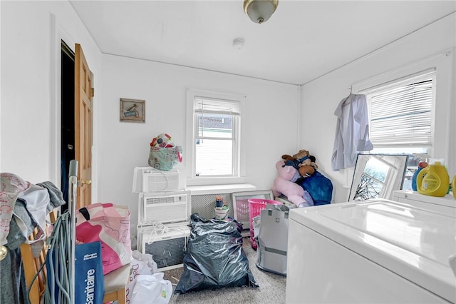 washroom featuring carpet floors and washer / dryer