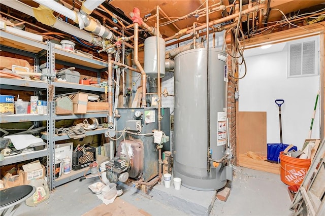 utility room featuring water heater