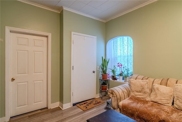 interior space with crown molding and wood-type flooring