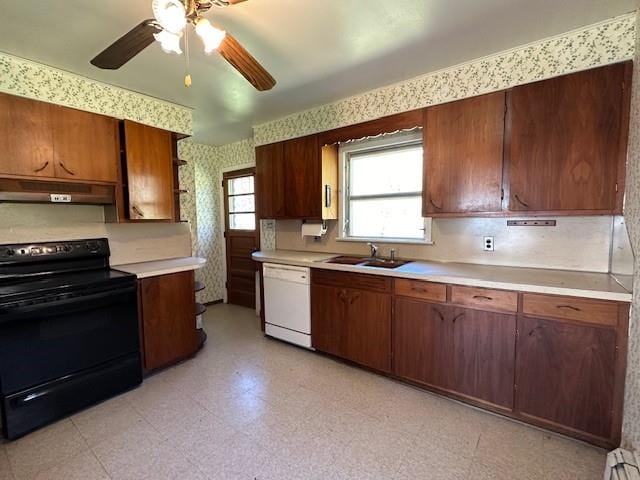 kitchen featuring dishwasher, black electric range oven, sink, and ceiling fan