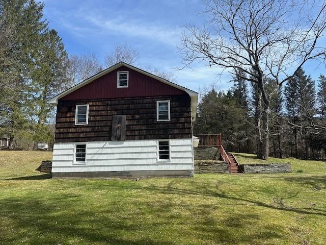 view of property exterior featuring a yard