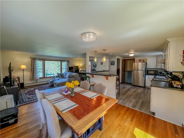 dining room featuring light hardwood / wood-style flooring