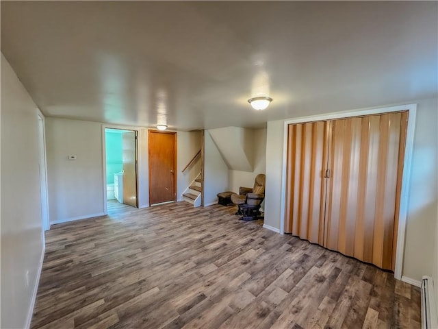 interior space with hardwood / wood-style floors and a baseboard radiator