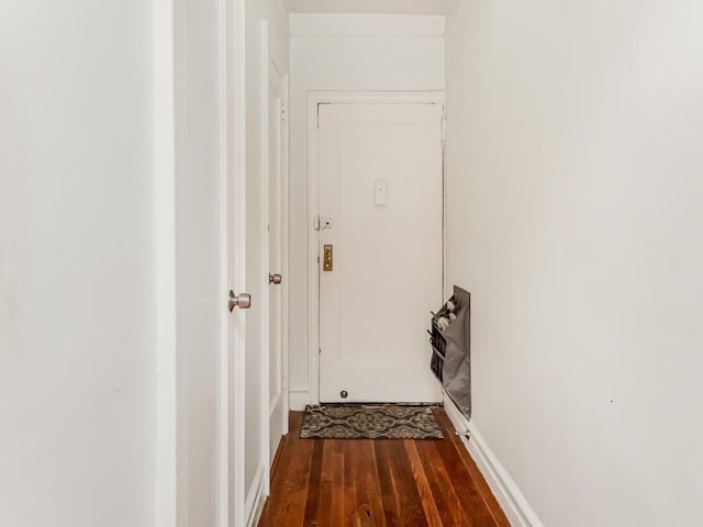 corridor with dark wood-type flooring