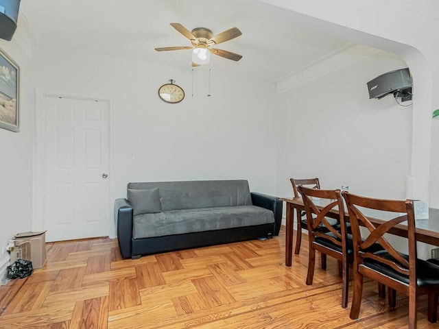 dining room with light parquet floors and ceiling fan