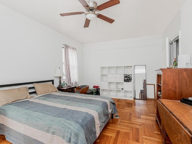 bedroom with ceiling fan and light parquet flooring