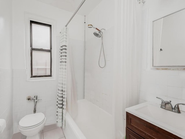 full bathroom with tile patterned flooring, shower / bath combination with curtain, vanity, and tile walls