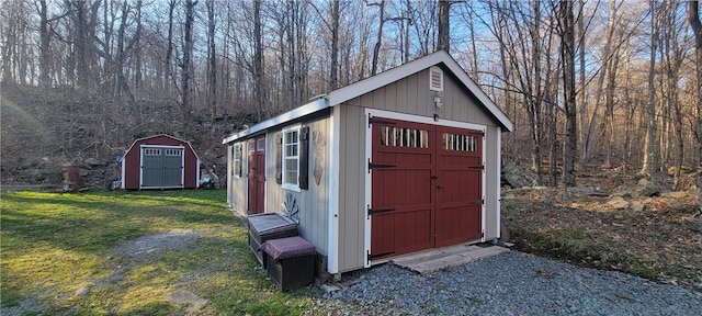 view of outbuilding with a lawn