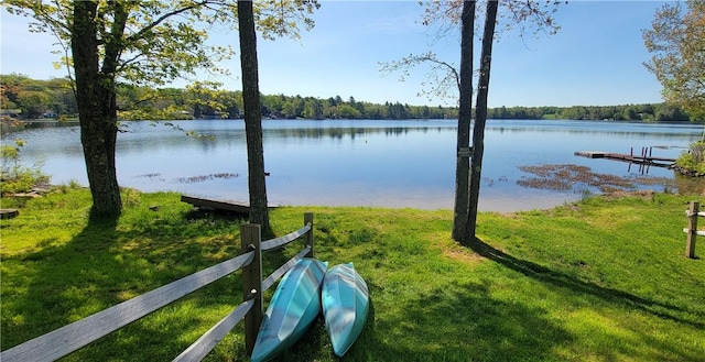 exterior space with a water view and a yard