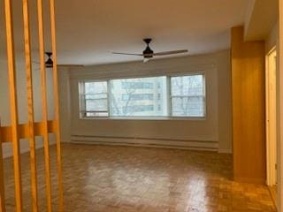 interior space featuring parquet flooring, plenty of natural light, and ceiling fan