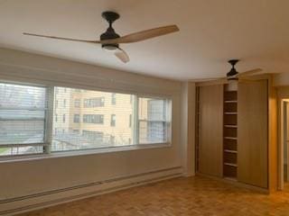 interior space featuring parquet flooring and ceiling fan