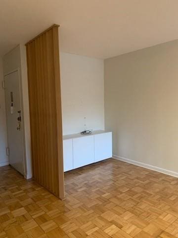 spare room featuring light parquet floors