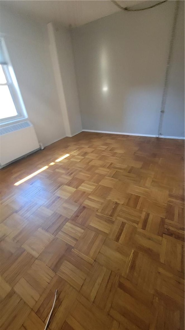 spare room featuring light parquet floors