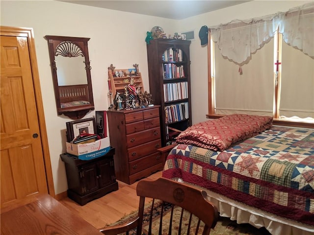 bedroom featuring hardwood / wood-style flooring