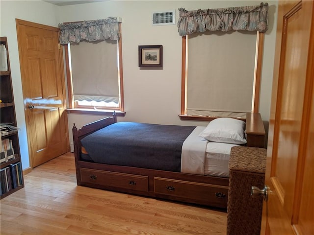 bedroom with light wood-type flooring