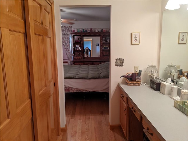 bathroom featuring wood-type flooring and ceiling fan