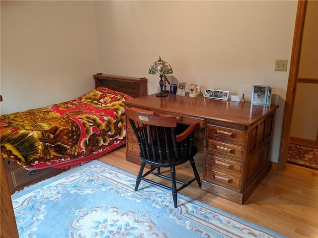 bedroom with light wood-type flooring