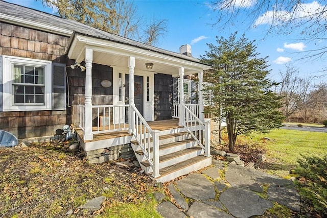 doorway to property with covered porch