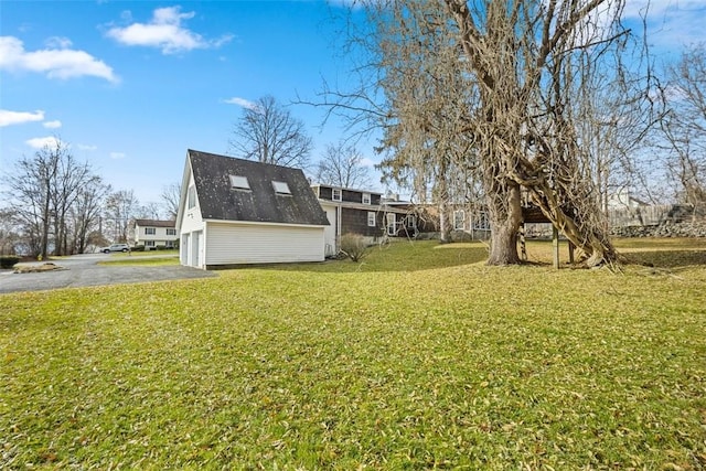 view of yard featuring a garage