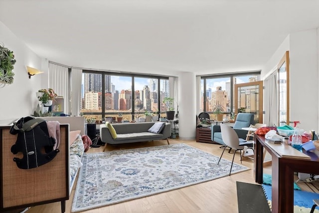 living room with a city view and wood finished floors